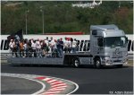 Foto: kierowcy F1 na platformie podczas rundy wokół toru - fot. Adam Babiel